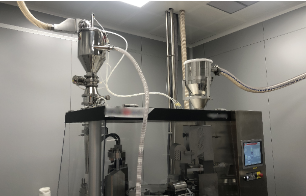 Carico capsulatrice per industria farmaceutica con Delfin Pneumatic Conveyors